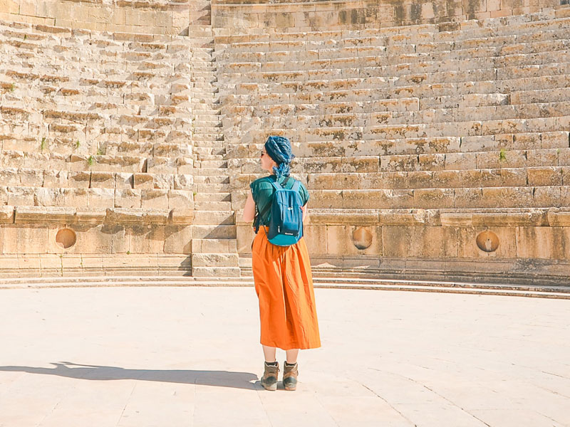 Traveler in Ancient Amphitheater